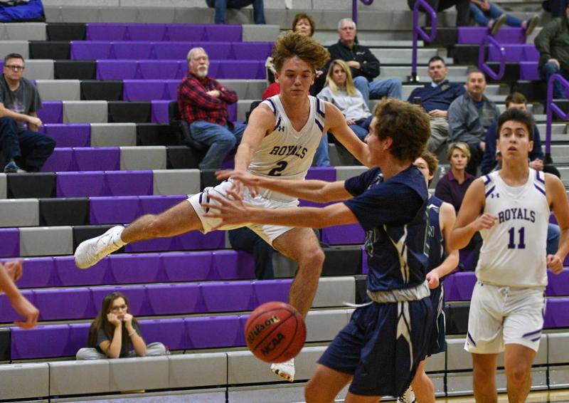 Royals freshman Gabe Herling gets airborne to make an assist in the Delmarva Christian 67-15 win over the Herons. He was the high scorer for the game with 14 points. DAN COOK PHOTOS