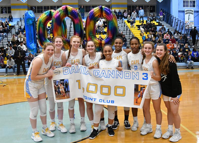The Cape girls’ basketball squad celebrates Dania Cannon’s 1,000th point. Shown are (l-r) Carlin Quinn, Abbey Hearn, Morgan Mahoney, Lauryn Head, Cannon, Mehkia Applewhite, Abigail Ikechi-Konkwo, Ella Rishko and Ryleigh Elliott.