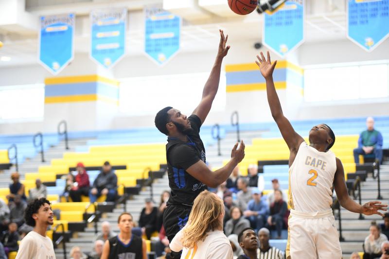 Kendron Wayman rolls in for a left-handed basket. DAVE FREDERICK PHOTOS