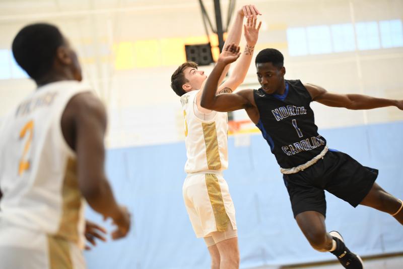 Colin Mallet gets off his shot.