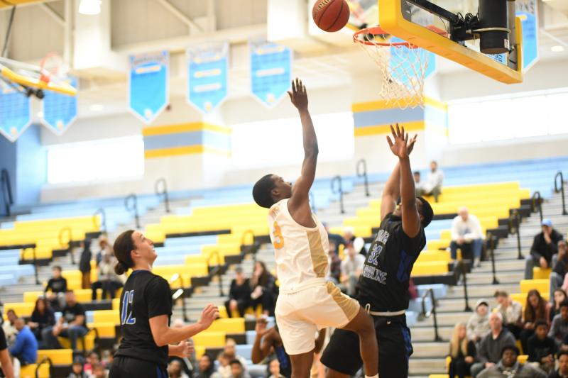 Kris Rushin gets his fourth foul on Kendron Wayman, sending him for bench respite.