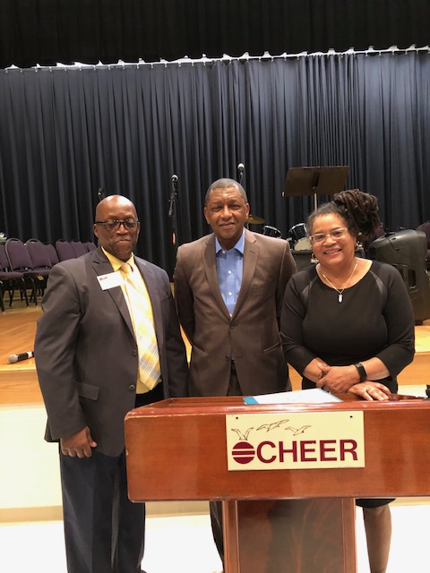 Diaz Bonville, Dr. Howard Stevenson , keynote speaker, and Christy Stevenson Taylor pose for a photo.