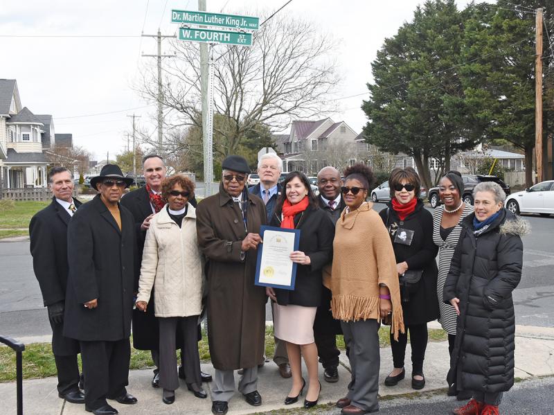 Members of the Lewes African American Heritage Commission and elected officials gather under the new sign. Shown are (l-r) Rep. Steve Smyk, R-Milton; Bishop Arthur D. Jones; Sen. Ernie Lopez, R-Lewes; the Rev. Deborah McCaffity; the Rev. George Edwards Sr.; Mayor Ted Becker; State Auditor Kathy McGuiness; Bill Collick; Trina Brown-Hicks; Alicia Jones; Stacie Burton, community liaison, Office of the Governor; and Rachel Grier-Reynolds.