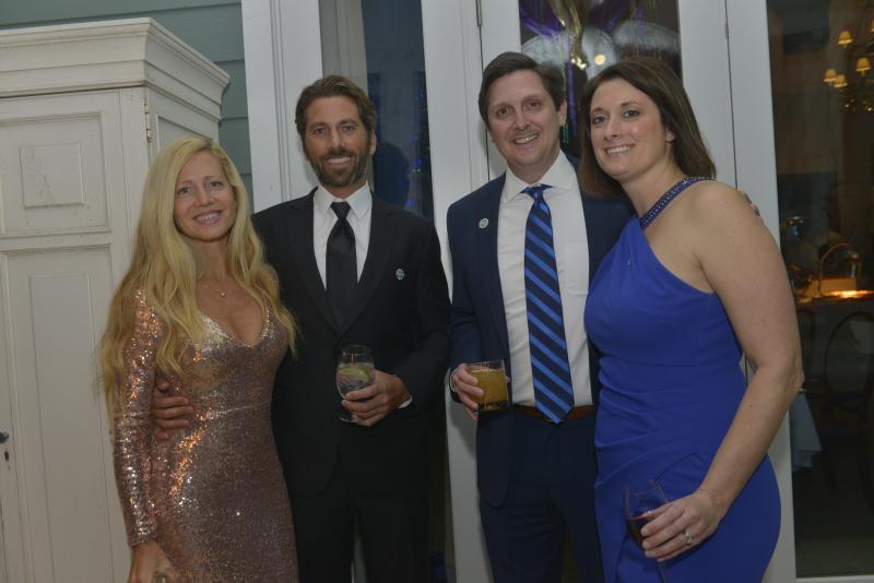 Enjoying the event on the covered balcony are (l-r) Lisa and Tyler Malone, and Dave and Eugenia Hert. Great Futures Gala 2020