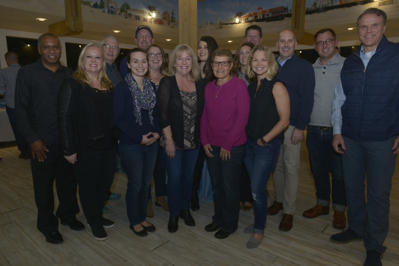 The CHEF Board of Directors gathers for a group photo in the silent auction room. Shown in back are (l-r) Calvin Jackson, Board President Rick Grier-Reynolds, Mike Dmiterchik, Alison Hughes, Alison Selders, Stephanie Mastrangelo, Vince Robertson, Gavin Rudka, and Michael Curry. In front are Ashley Reynolds, Lindsay Dodge, Gail Mack, Connie Kaden, Melissa Clampitt, and Superintendent Bob Fulton. CHEF Winter Jam 2020