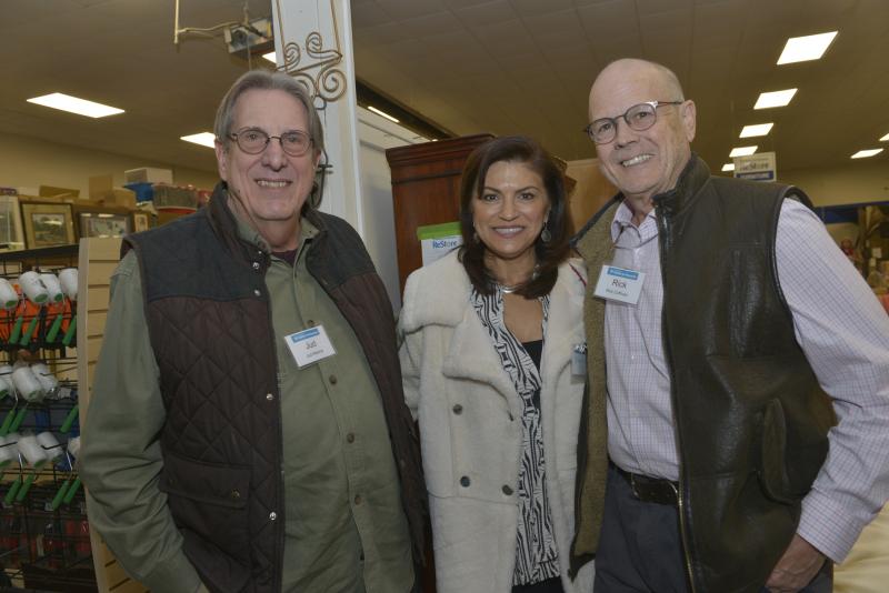 Sussex Habitat donators and buyers (l-r) Judd Malone, and Dionnisia and Rick Coffman socialize at the event. SCHFH Winter Reception