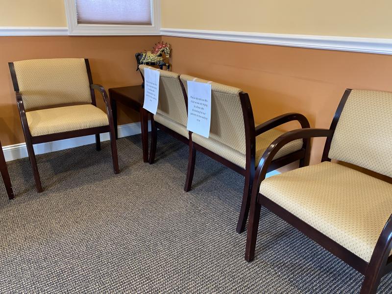 Chairs are turned backward in a doctor’s office to enforce social distancing. DENY HOWETH PHOTO