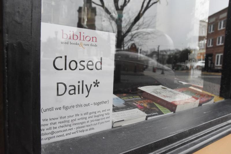 Biblion bookstore in downtown Lewes typically has a sign in the window that says open daily. In these unprecedented times, owner Jen Mason found a way to offer some levity. NICK ROTH PHOTO