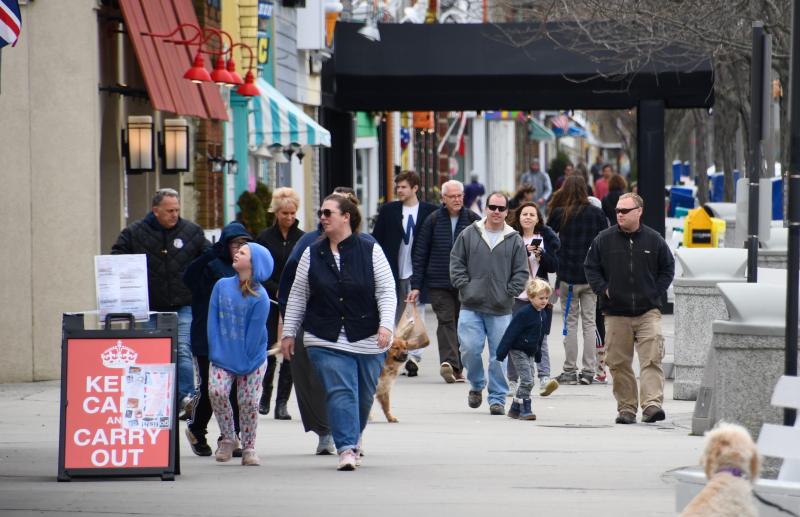Thanks to record temperatures on March 20, crowds poured into Rehoboth Beach. Even with a drastic change in the weather on March 21, tourists are still out and about. RON MACARTHUR PHOTO