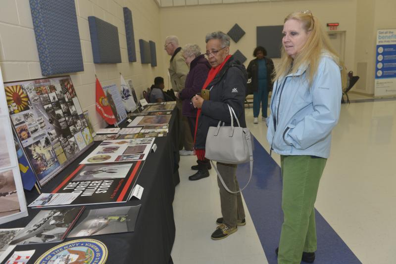 Browsing a display of the contributions to the Navy by African American servicemen are Arlene Reed, left, and Pat Petrecca. CHEER Black Culture Day