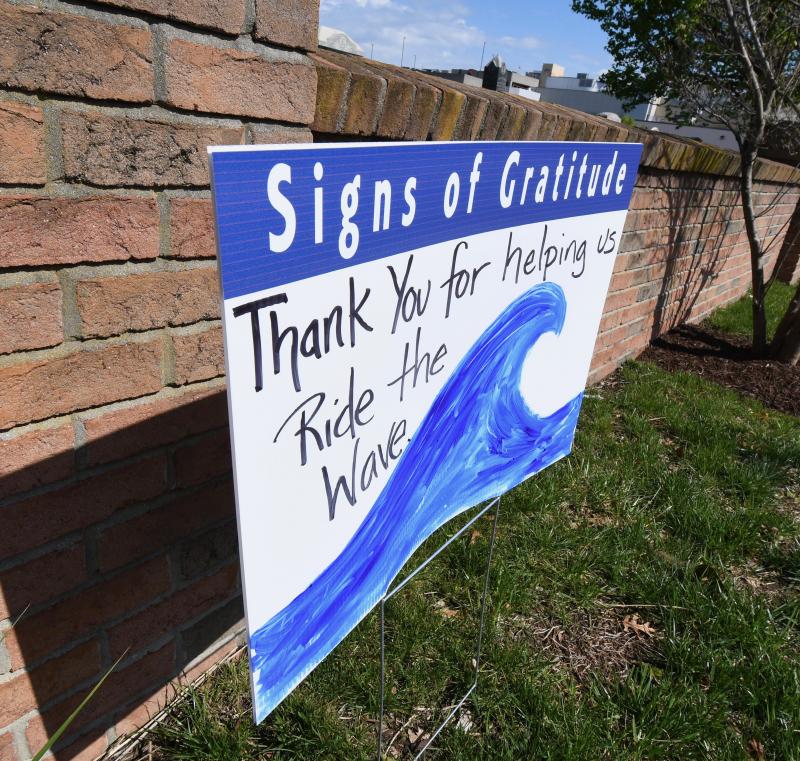 A sign of gratitude is placed across the street from Lloyd’s Market in Lewes.