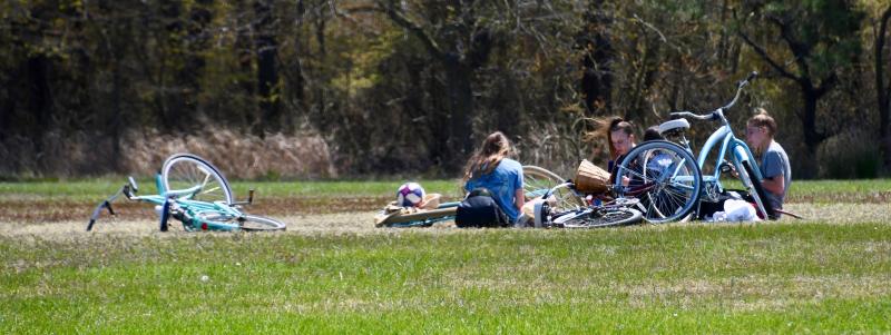 Youngsters find a spot away from everyone else in the middle of the parade grounds at Cape Henlopen State Park.