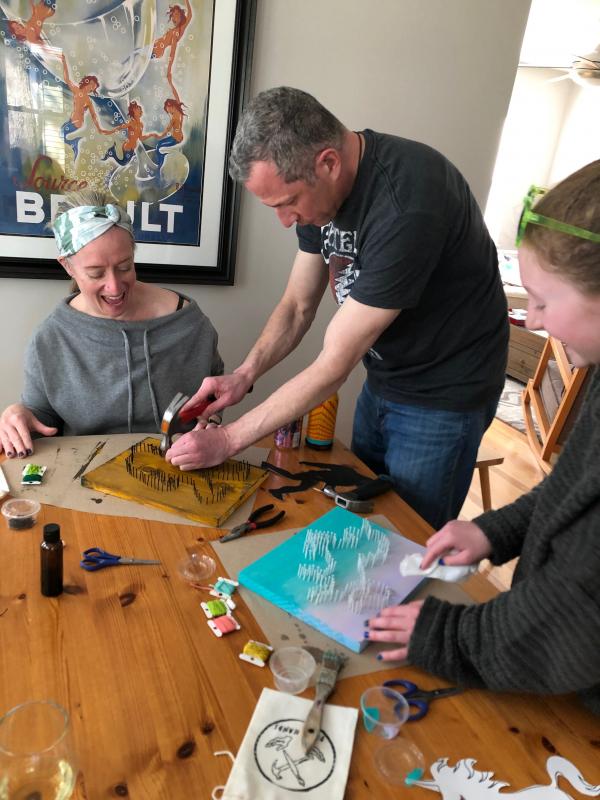 Working on a string art DIY project are (l-r) Kim, Brian, and Calla Privor of Washington, D.C., and Dewey Beach.