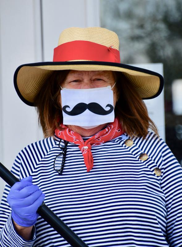 Lewes Yacht Club restaurant manager Adrienne Hastings is dressed the part for curbside pickup of spaghetti and meatballs dinners. The club offers grab-and-go dinners to its members two times a week.