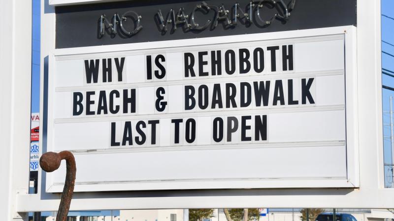 A sign at Anchorage Motel along Route 1 points to the frustration some business owners are experiencing. Officials say the Boardwalk and beach in Rehoboth will reopen Friday, May 15.