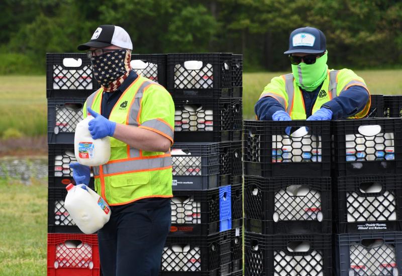 Delaware Department of Transportation employees man one of the distribution lines set up at the high school.