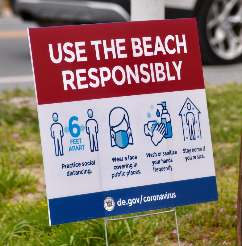 New signs from state health officials greet beachgoers in the Cape Region.