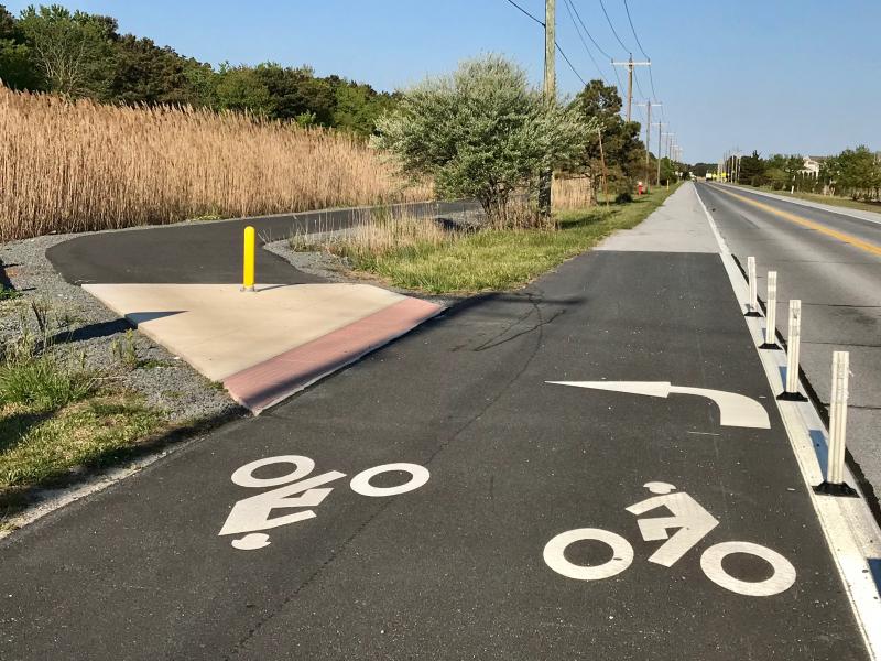 Recently added markings on the Grand Cape Loop Trail coming out of Cape Henlopen State Park and headed toward Lewes make it clear that cyclists should bear left from the shoulder onto the trail that makes its path all the way to Savannah Road.