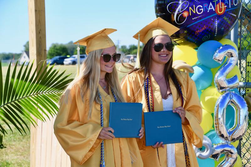 Cape High graduates Autumn Davis, left, and Delaney Zolper pose for photographer Dan Cook at the end of the Journey of the Class of 2020.