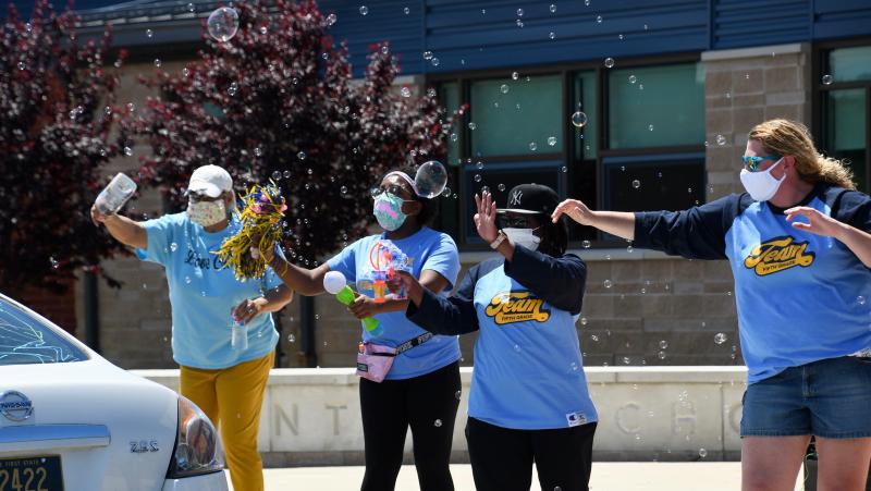 Love Creek Elementary staff (l-r) paraprofessional Beverly Kenner and teachers Tykia Duffy, Beonica Duffy and Kelly Hynes whoop it up for their students. RON MACARTHUR PHOTO