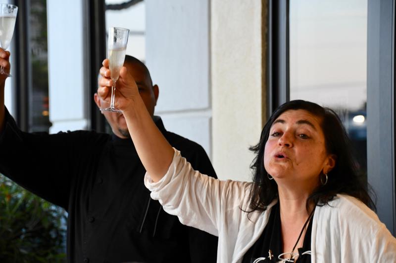 Anita Broccolino, Lefty’s Alley & Eats director of sales, raises her glass in a toast to the new patio and the reopening of Lefty’s.
