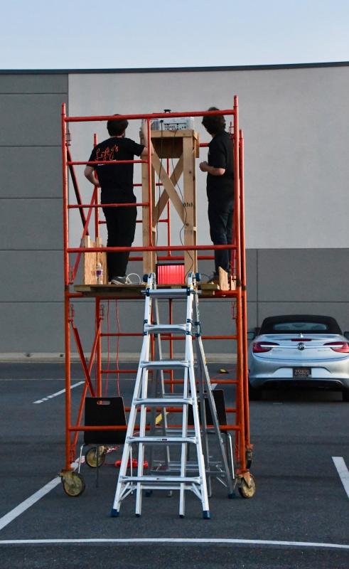 Lefty’s employees prepare to show the movie “Rocky” during the premiere of Lefty’s new drive-in theater.