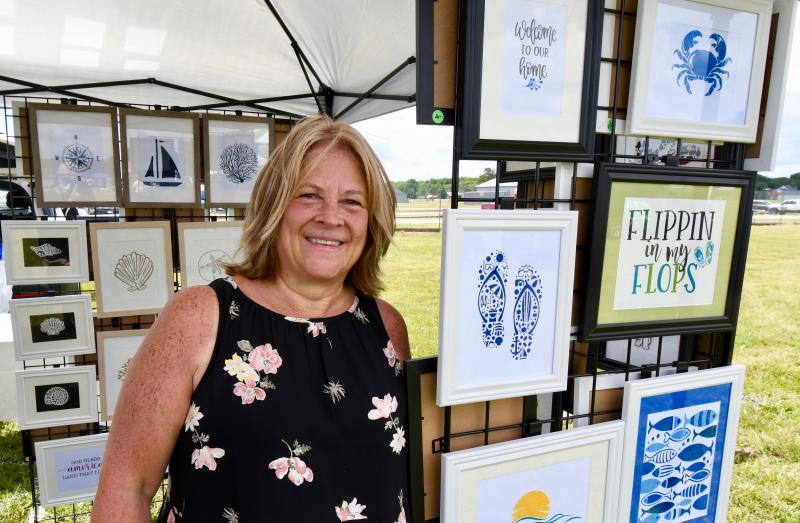 Susan Akins of Selbyville displays her unique beach-art work.