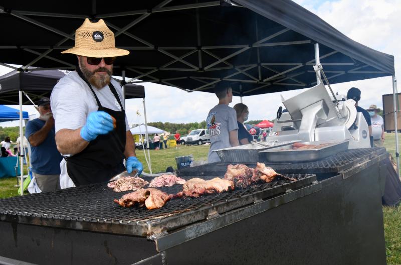 Chris Desch of Chaps Pit Beef has the hottest job at the expo as he cooks beef.