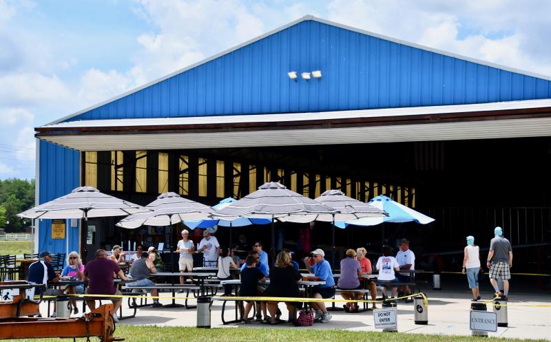 Revelation Beer Garden, in an Eagle Crest hangar at Hudson Fields, is open during the home expo.