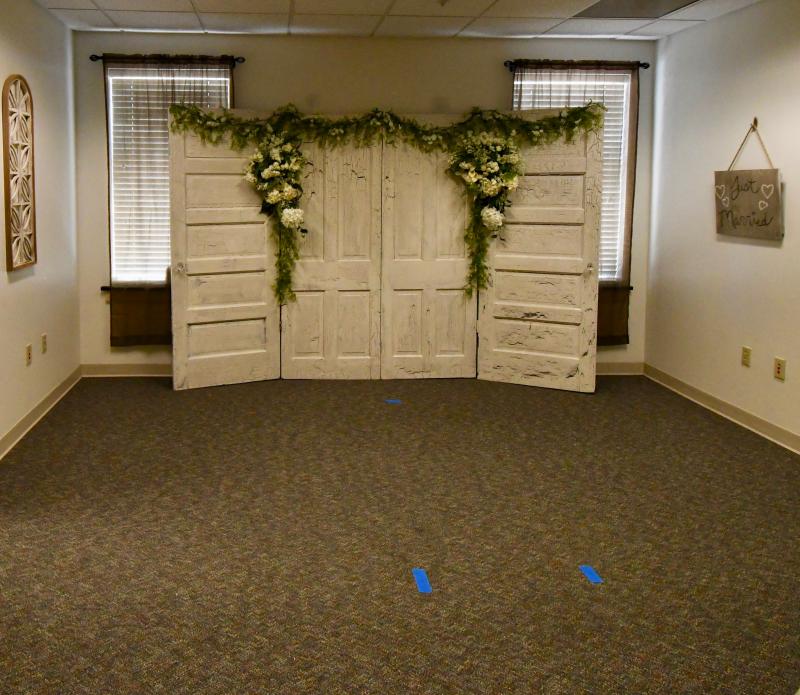 The Sussex County Marriage Bureau is set up to perform ceremonies in its county administration building office. Couples can get their license in one office and walk to this room to get married immediately without a 24-hour waiting period. However, family members and friends are not allowed in the office.