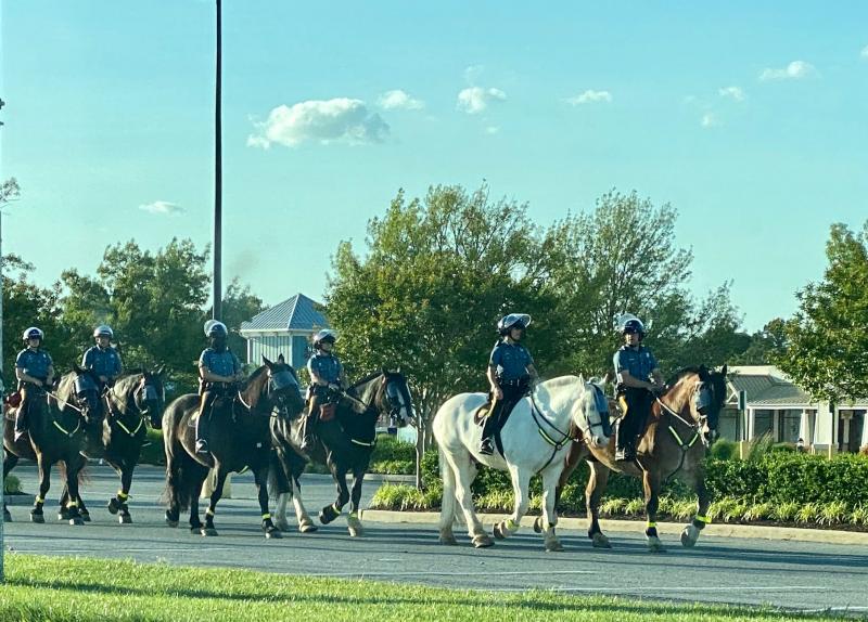 Mounted state police troopers take their positions at Tanger Outlets on Route 1 in Rehoboth Beach. JEN ELLINGSWORTH PHOTO