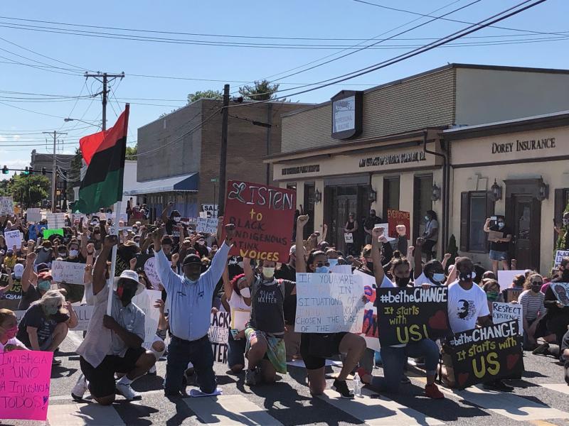 Hundreds of protesters participated in a peaceful demonstration in downtown Milford June 14. The silent march climaxed with protesters taking a knee in front of Centennial Park and remembering the life of George Floyd, who was killed in the custody of Minneapolis police officers and whose death has inspired nationwide protests against police brutality. RYAN MAVITY PHOTOS