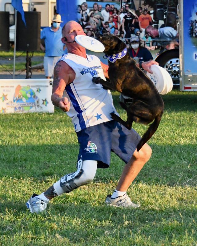 Galaxy Girl makes close contact with her trainer Lawrence Frederick during the Disc-Connected K9s Show.