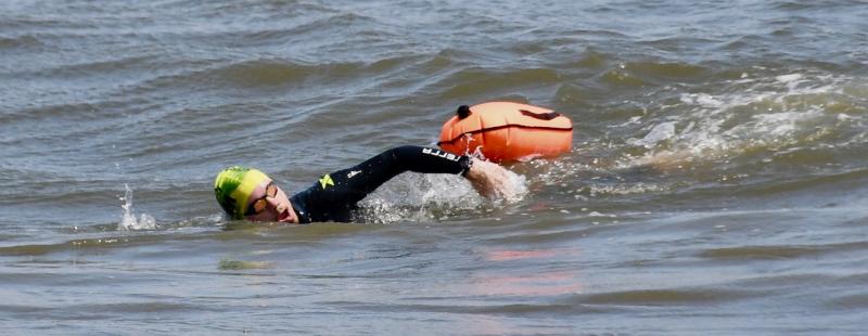 Jake Bamforth swims the final few feet of his journey from Cape May. N.J. He’s only one of a few to make the crossing Delaware Bay-Atlantic Ocean crossing. RON MACARTHUR PHOTO