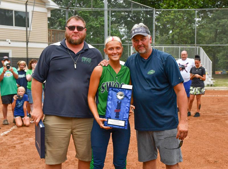 Swoop 18U catcher Savannah O’Shields, center, receives the Tournament MVP from coach Sam O’Shields, left, and manager Jay Davis.
