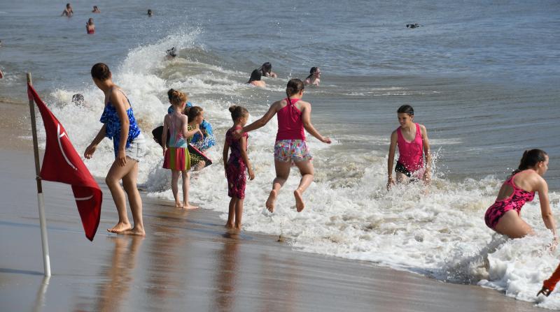 Youngsters take advantage of an early-beach day Aug. 3, a day before Tropical Storm Isaias blew through the Cape Region.