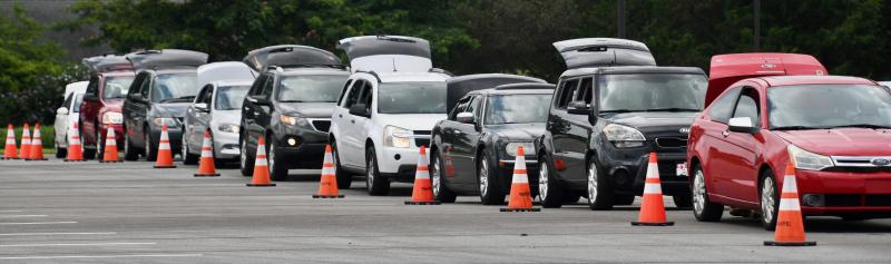 Cars, with their trunks and hatchbacks up, line up at the Food Bank of Delaware pantry Aug. 3 at Crossroad Community Church near Georgetown.