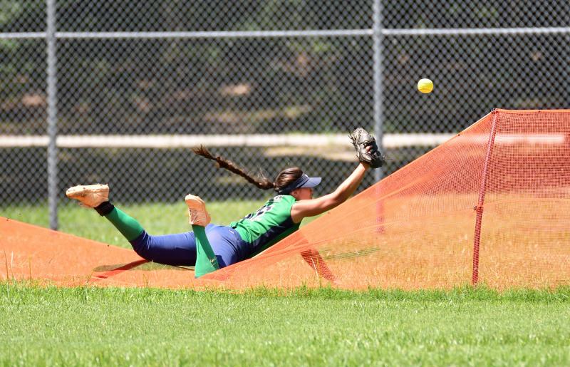 Diamond State Swoop left fielder Maria Kollar makes a Sportscenter effort for a K&K Raptor home run in the Swoop 4-3 victory at the USSSA Eastern National Championships.