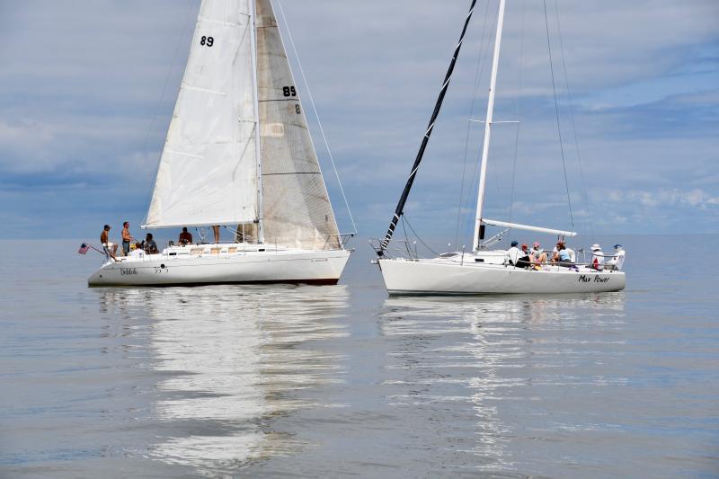 Boats are at a standstill with no wind as the start of the event is delayed for two hours.