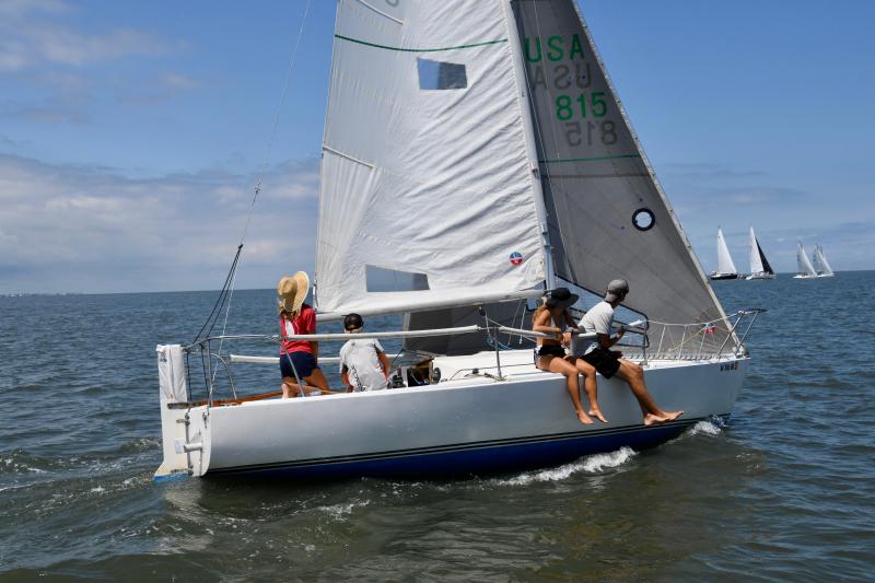 The young crew of Dead Baby Bird prepares for the start of the spinnaker-class race. The Corinthian team finished in fourth place.