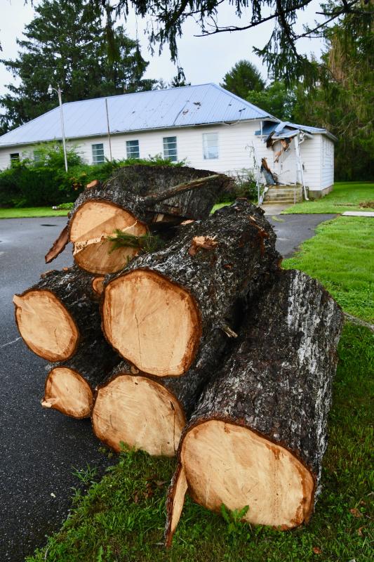 In the aftermath of Tropical Storm Isaias, a large pile of wood is stacked at Henlopen Grange No. 20 on Savannah Road, Lewes. Damage was done to the building during the Aug. 4 storm.