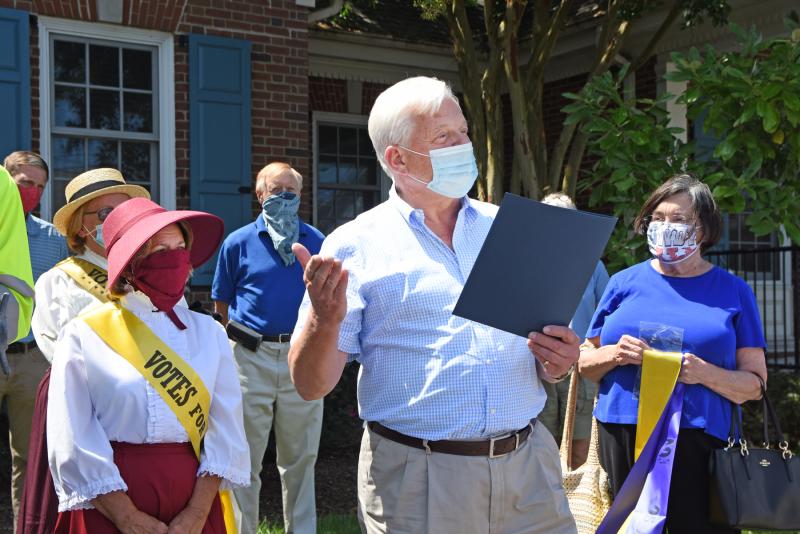 Mayor Ted Becker reads a proclamation celebrating the 100th anniversary of women’s right to vote.