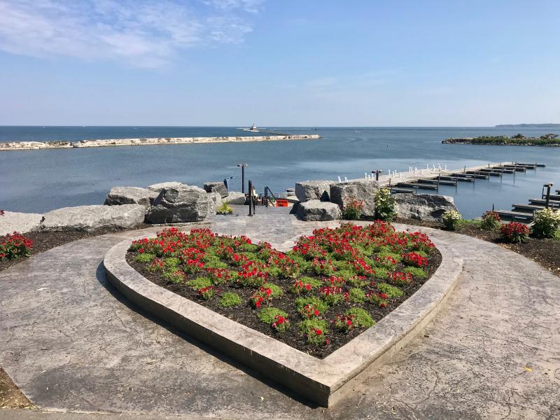 This shows a view of the manmade harbor in Oswego where the Oswego River opens on to Lake Ontario. Breitbark Park shares a high bluff where this photograph was made. When we passed the lighthouse marking the entrance to the harbor, we turned right toward the northeast and set a 30-mile course for Sacket's Harbor.