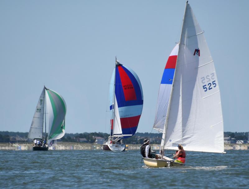 Boats taking part in the annual LYC Labor Day race head toward the finish line in front of the club near Roosevelt Inlet.