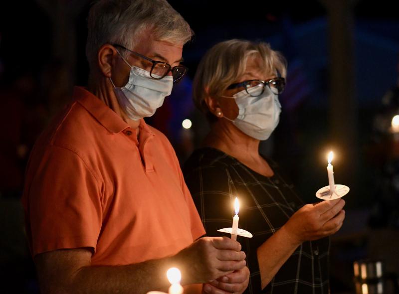 Bob and Janie Mericsko of Frankford stand in silence during a candlelight ceremony for Sept. 11 victims.