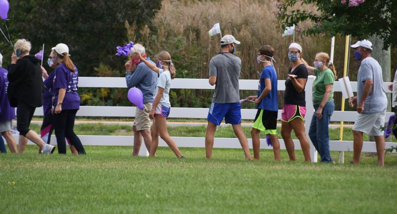 Walkers begin a 2-mile trek around the Villages of Five Points trail Sept. 26 as they walk to raise money for Alzheimer’s research.