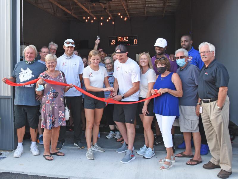 Shown at the ribbon-cutting ceremony with Milton Chamber of Commerce are in front (l-r) Tom Jones, Milton Chamber board; Vicki Sammons, Milton Chamber board; Andy Hewitt; Megan Weber, owner; Michael Sager, owner; Erika Sager; Kathy Clark, Milton Chamber co-director; Elliot Welan, Milton Chamber board; and Michael Clark, Milton Chamber board. NICK ROTH PHOTO