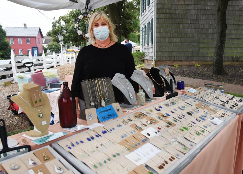 Kathy Shelton of Sea Foam Creations stands in her booth. She makes handcrafted beach jewelry and decor with authentic sea glass and shells.