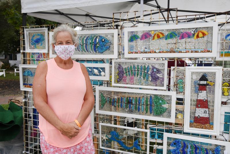 Artist Margie Samero of Step by Stepping Stones creates crushed stained glass art, shown, and stepping stones.