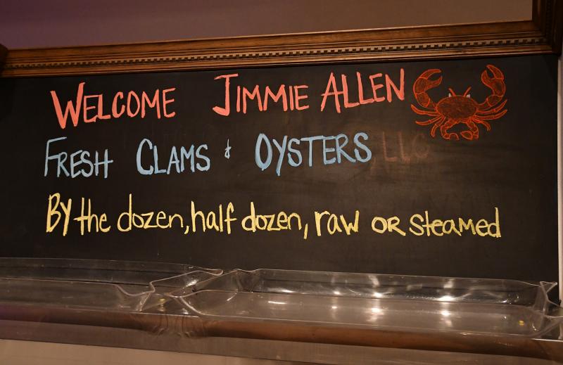 Sydney’s raw bar menu board announces Jimmie Allen along with the restaurant’s specialties from the sea.